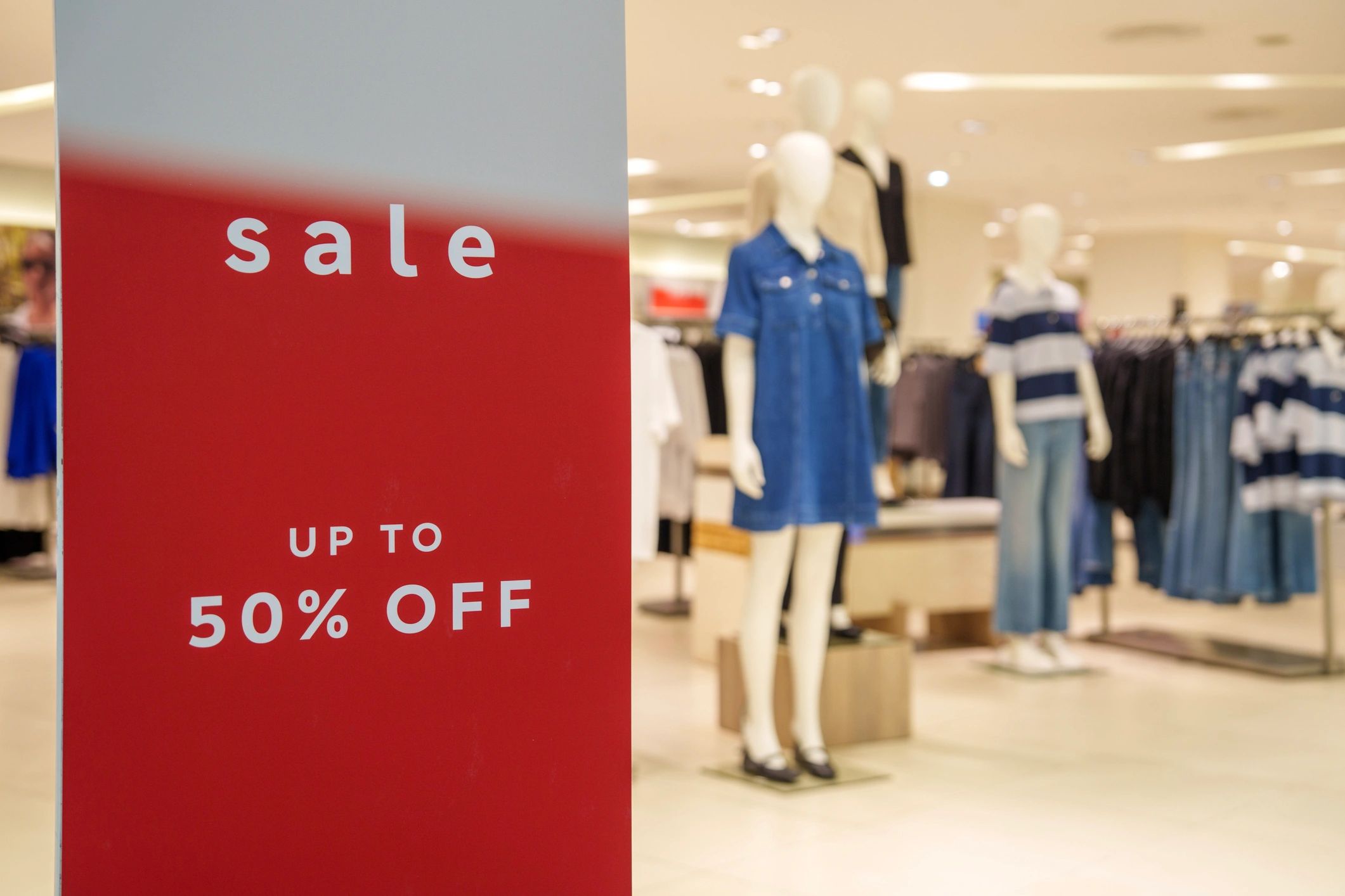 Retail display sign representing promotional products and branded merchandise